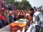 Wife of Naib Subedar Rakesh Kumar mourns after his mortal remains were brought to his residence in Mandi district. (PTI)