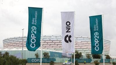 A banner flag featuring the logo of Nio Inc. at the COP29 climate conference in Baku, Azerbaijan, on Monday. (Bloomberg) A banner flag featuring the logo of Nio Inc. at the COP29 climate conference in Baku, Azerbaijan, on Monday. (Bloomberg)