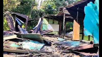 Charred remains of a house set ablaze allegedly by Kuki militants is pictured at Kangchup village in Imphal West district on Monday. (AFP) Charred remains of a house set ablaze allegedly by Kuki militants is pictured at Kangchup village in Imphal West district on Monday. (AFP)