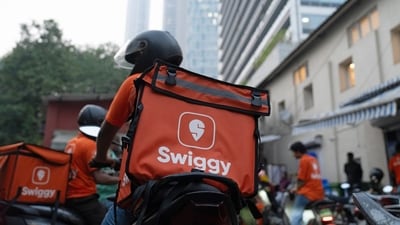 Swiggy Ltd. delivery workers on motorcycles outside a company's dark store in Mumbai. (Bloomberg) Swiggy Ltd. delivery workers on motorcycles outside a company's dark store in Mumbai. (Bloomberg)