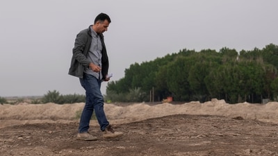 Dr Jaafar al Jotheri holds satellite images and explores the site of the Battle of al-Qadisiyah, which was fought in Mesopotamia - present-day Iraq - in the 630s AD between Arab Muslims and the army of the Sassanid Persian dynasty during a period of Muslim expansion. (AP) Dr Jaafar al Jotheri holds satellite images and explores the site of the Battle of al-Qadisiyah, which was fought in Mesopotamia - present-day Iraq - in the 630s AD between Arab Muslims and the army of the Sassanid Persian dynasty during a period of Muslim expansion. (AP)