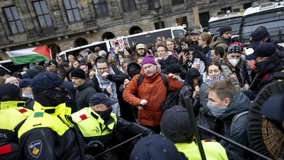 Protesters take part in a Pro-Palestinian demonstration on Dam Square in Amsterdam on November 10. The protest was taking place while an emergency ordinance and demonstration ban are in place in the city. These were previously deployed following tensions and violence surrounding supporters of Israeli football club Maccabi Tel Aviv. (AFP) (AFP) Protesters take part in a Pro-Palestinian demonstration on Dam Square in Amsterdam on November 10. The protest was taking place while an emergency ordinance and demonstration ban are in place in the city. These were previously deployed following tensions and violence surrounding supporters of Israeli football club Maccabi Tel Aviv. (AFP) (AFP)