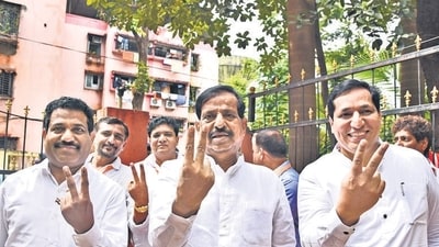 Navi Mumbai, India - October 24, 2019: (L to R): Sanjeev Naik, BJP Candidate Ganesh Naik and Sandeep Naik shows voctory sign before entering Vote Counting Center at Airoli in Navi Mumbai, India, on Thursday, October 24, 2019. (Photo by Bachchan Kumar/ Hindustan Times) (Hindustan Times) Navi Mumbai, India - October 24, 2019: (L to R): Sanjeev Naik, BJP Candidate Ganesh Naik and Sandeep Naik shows voctory sign before entering Vote Counting Center at Airoli in Navi Mumbai, India, on Thursday, October 24, 2019. (Photo by Bachchan Kumar/ Hindustan Times) (Hindustan Times)
