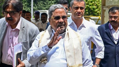 Karnataka Chief Minister Siddaramaiah with his legal advisor Ponnanna. (PTI) Karnataka Chief Minister Siddaramaiah with his legal advisor Ponnanna. (PTI)