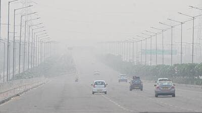 Smog seen on Airport Road in Mohali on Tuesday. (Keshav Singh/HT)