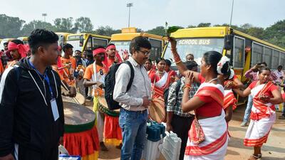 Tribal women perform well wishing for the polling officials prior to the departure for the election duty on the eve of first phase of Jharkhand Assembly elections, at Morabadi Football ground, in Ranchi on Tuesday. (ANI)