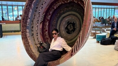 Mouni Roy sat on an interesting patchwork swing in one of the pictures. She posed in a white shirt and black trousers outfit. Mouni Roy sat on an interesting patchwork swing in one of the pictures. She posed in a white shirt and black trousers outfit.