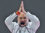 Amit Shah greets BJP supporters during a public rally in Maharashtra. 