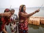Devotees offer prayers on the banks of holy river Ganga (For Representation) Devotees offer prayers on the banks of holy river Ganga (For Representation)