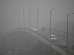 Commuters drive amid dense smog in New Delhi 