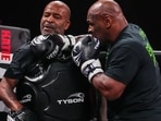 Mike Tyson, right, works out ahead of his boxing match against Jake Paul, Tuesday, Nov. 12, 2024, in Irving, Texas. 