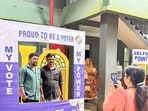 Voters get their photos clicked at a selfie booth after casting their votes for Wayanad Lok Sabha by-elections, on Wednesday. (ANI)