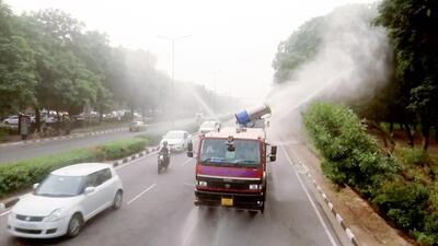 A truck-mounted water sprinkler sprays water in an effort to mitigate the effects of air pollution in Chandigarh, which woke up to a smoggy morning on Wednesday. (ANI Photo) A truck-mounted water sprinkler sprays water in an effort to mitigate the effects of air pollution in Chandigarh, which woke up to a smoggy morning on Wednesday. (ANI Photo)