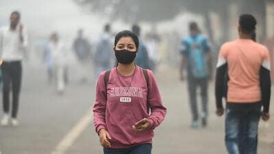 A woman dons a mask while walking in a public place as pollution levels hit a new high on Wednesday. (Sunil Ghosh/HT Photo) A woman dons a mask while walking in a public place as pollution levels hit a new high on Wednesday. (Sunil Ghosh/HT Photo)