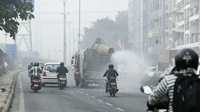 On Wednesday, a truck-mounted water sprinkler sprays tiny droplets of water to mitigate the effects of air pollution as a thick layer of smog engulfs the National capital.&nbsp; (ANI)