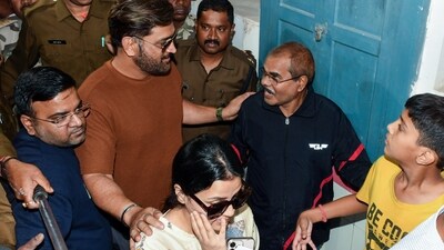 Former Indian cricket captain Mahendra Singh Dhoni and his wife Sakshi arrive to cast their vote for the first phase of the Jharkhand Assembly elections, in Ranchi on Wednesday. (ANI)