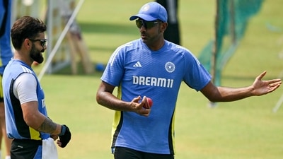 India's Ravichandran Ashwin (R) and Virat Kohli attend a practice session (AFP)