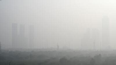 Noida’s tall buildings were barely discernible in the low visibility conditions on Wednesday, brought about by the thick smog. (Sunil Ghosh/HT Photo)