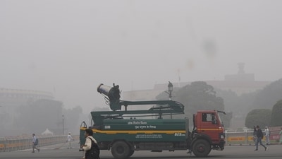 An anti-smog gun is being used to spray water droplets to curb air pollution amid smog, in New Delhi. (PTI)
