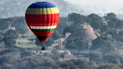 Raisen, Nov 13 (ANI): A hot air balloon flies in the air over UNESCO's world heritage site Sanchi Stupas during a hot air balloon show. Madhya Pradesh hosted India’s first state-level pre-COP consultation, bringing together environmental experts, policymakers, and local stakeholders to develop regional solutions aligned with India’s climate action framework, Panchamrit. ANI Photo) (Sanjeev Gupta) Raisen, Nov 13 (ANI): A hot air balloon flies in the air over UNESCO's world heritage site Sanchi Stupas during a hot air balloon show. Madhya Pradesh hosted India’s first state-level pre-COP consultation, bringing together environmental experts, policymakers, and local stakeholders to develop regional solutions aligned with India’s climate action framework, Panchamrit. ANI Photo) (Sanjeev Gupta)