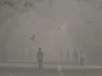 A man jogs as he participates in a marathon while the sky is enveloped with smog after Delhi’s air quality was classified as "hazardous".