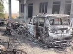 Charred remains of vehicles after violence erupted outside a polling booth