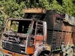 The remains of a truck set ablaze by militants in Jiribam district, Manipur, on Wednesday. (PTI)