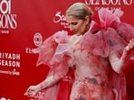 Singer Celine Dion poses on the red carpet ahead.