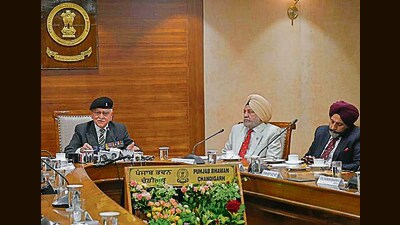 Lt Gen TS Shergill (retd) and other officials interacting with media in Chandigarh on Thursday. (Ravi Kumar/HT)