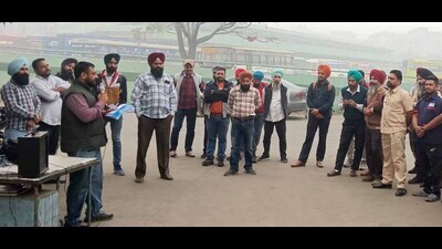 Punjab Roadways/Punbus/PRTC contractual workers protesting over unmet demands in Ludhiana on Thursday. (HT Photo)