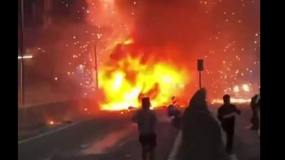 A screengrab of the incident shows people running to save their lives after the ambulance exploded. (@JamilKhabir396/X) A screengrab of the incident shows people running to save their lives after the ambulance exploded. (@JamilKhabir396/X)