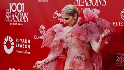 Singer Celine Dion poses on the red carpet ahead. (REUTERS)