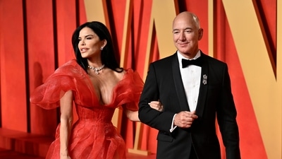Lauren Sanchez, left, and Jeff Bezos arrive at the Vanity Fair Oscar Party (Evan Agostini/Invision/AP) Lauren Sanchez, left, and Jeff Bezos arrive at the Vanity Fair Oscar Party (Evan Agostini/Invision/AP)