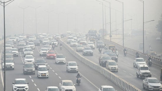 Commuters wade through dense smog as air quality dips to the 'Severe' category in New Delhi. (ANI)