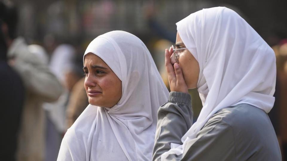 Panic-stricken students after the fire broke out at the Muslim Public High School in Srinagar on Thursday. (PTI Photo)