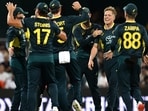 Australia's Nathan Ellis celebrates the wicket of Pakistan's Babar Azam with teammates Darren England/AAP Image via REUTERS    
