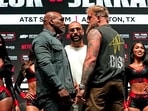 US boxer Mike Tyson (L) and US boxer-actor Jake Paul (R) face each other.