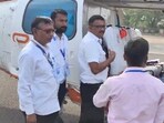 EC officials inspecting chopper of Union home minister Amit Shah EC officials inspecting chopper of Union home minister Amit Shah
