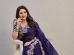 Purple is a regal colour, so no wonder Madhuri Dixit pulls off the colour so gracefully. Purple is a regal colour, so no wonder Madhuri Dixit pulls off the colour so gracefully.