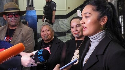 Hana-Rawhiti Maipi-Clarke, right, and her colleagues from Te Pāti Māori, talk to reporters following a protest inside Parliament in Wellington, New Zealand, Thursday, Nov. 14, 2024. (AP Photo/Charlotte Graham-McLay) (AP) Hana-Rawhiti Maipi-Clarke, right, and her colleagues from Te Pāti Māori, talk to reporters following a protest inside Parliament in Wellington, New Zealand, Thursday, Nov. 14, 2024. (AP Photo/Charlotte Graham-McLay) (AP)