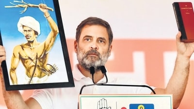 During the speech, Rahul Gandhi held up a picture of Birsa Munda saying that his thoughts were adopted in constitution. (PTI) During the speech, Rahul Gandhi held up a picture of Birsa Munda saying that his thoughts were adopted in constitution. (PTI)