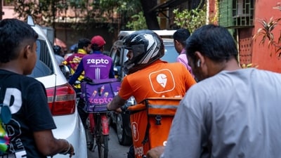 A Swiggy delivery worker on a motorcycle in Mumbai. (Bloomberg) A Swiggy delivery worker on a motorcycle in Mumbai. (Bloomberg)