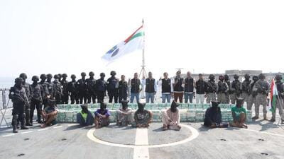 NCB officials with the arrested Iranian nationals after the narcotics bust off Gujarat coast on Friday. (Official handout photo) NCB officials with the arrested Iranian nationals after the narcotics bust off Gujarat coast on Friday. (Official handout photo)