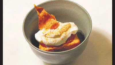 The Araku chain of cafes serves a tomato cake and saves the skin of the tomato to use as garnish. (ARAKU) The Araku chain of cafes serves a tomato cake and saves the skin of the tomato to use as garnish. (ARAKU)