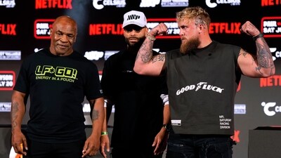 Mike Tyson, left, and Jake Paul, right, pose for photos. (AP)