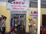 Firefighters work after a fire broke out in a neonatal intensive care unit at Jhansi Medical College hospital in Jhansi (AP)