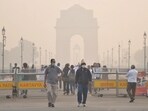 Visitors at the Kartavya Path near the India Gate amid smog, in New Delhi, Saturday,