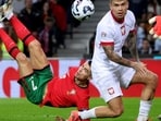 Portugal's Cristiano Ronaldo, left, scores his side's fifth goal with an overhead kick during the UEFA Nations League soccer match between Portugal and Poland at the Dragao stadium in Porto, Portugal. Portugal's Cristiano Ronaldo, left, scores his side's fifth goal with an overhead kick during the UEFA Nations League soccer match between Portugal and Poland at the Dragao stadium in Porto, Portugal.