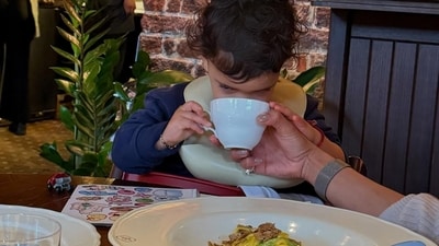 A photo showed Malti Marie Chopra Jonas sipping from a cup held by Priyanka Chopra as they sat inside a restaurant. 