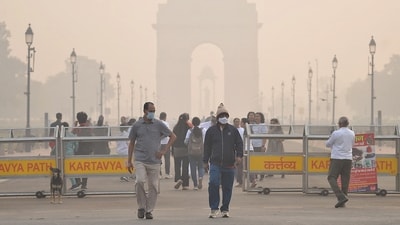 Visitors at the Kartavya Path near the India Gate amid smog, in New Delhi, Saturday, (PTI) Visitors at the Kartavya Path near the India Gate amid smog, in New Delhi, Saturday, (PTI)